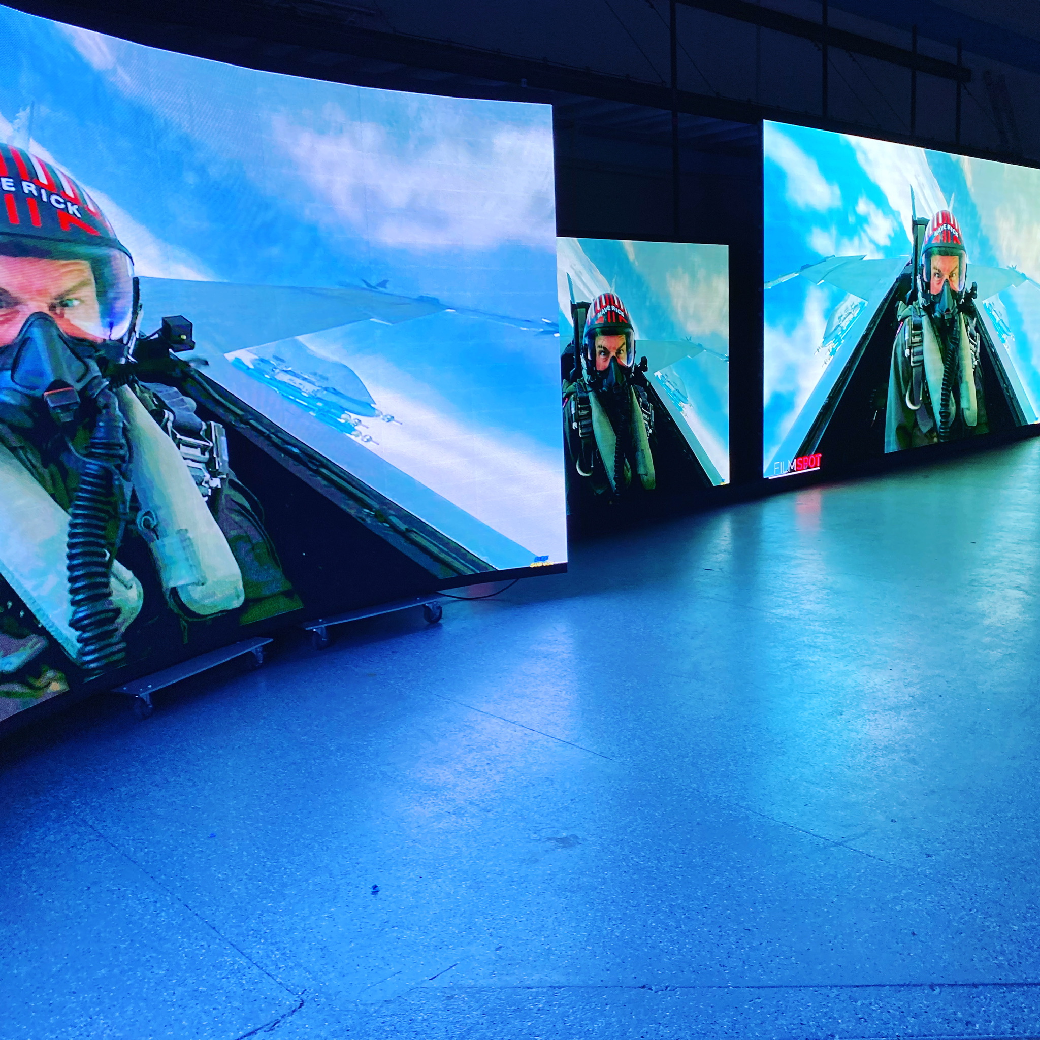 multiple curved led wall displays set up inside a public space